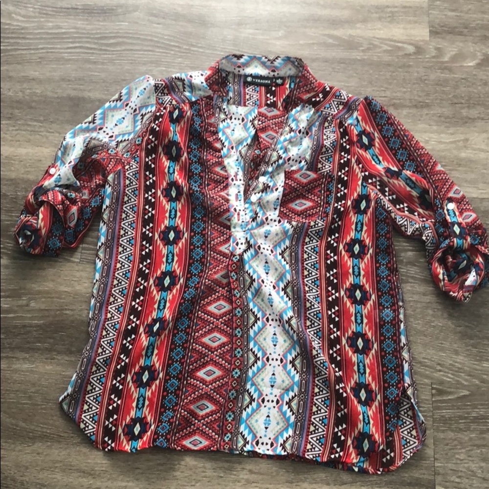 Multi print top. Sheer and button sleeve.